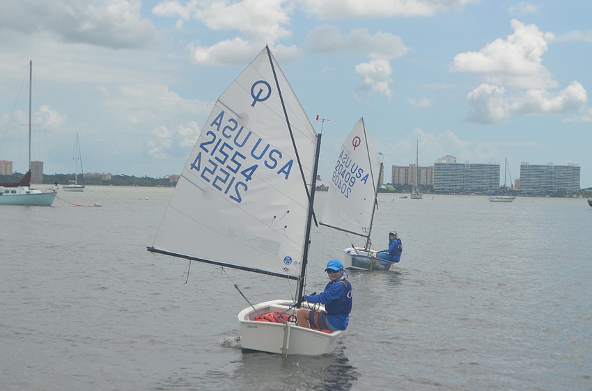 Preston Weaver, 11, and Zac Waldman, 13, take off during the Annual Labor Day Regatta.