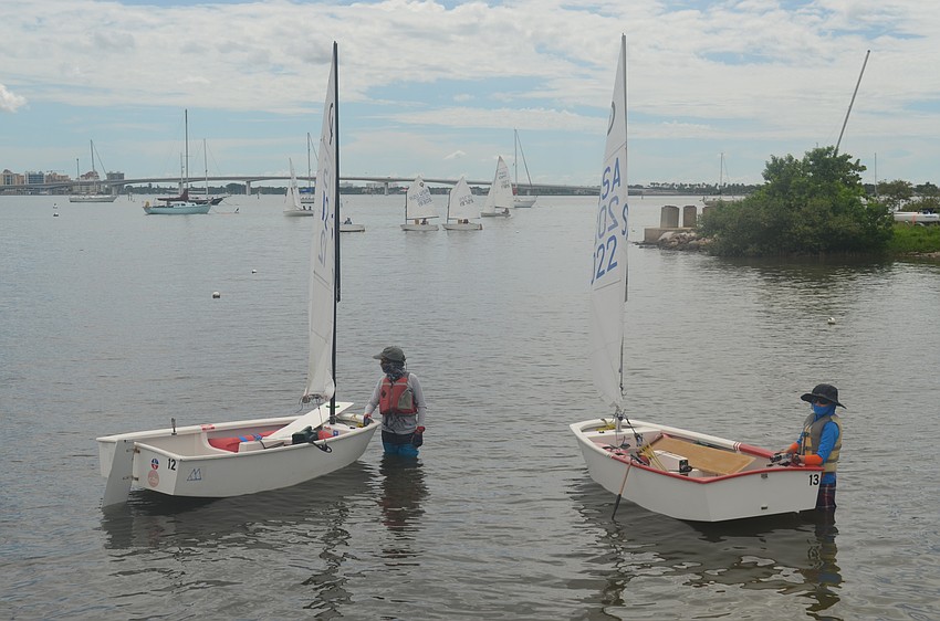 Alex Liebel, 11, and Ben Strom, 12, of Sarasota Youth Sailing get ready to sail.
