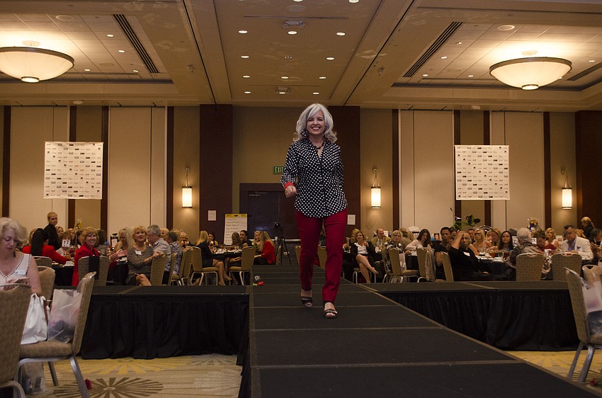 Marie Avery wears a bright smile on the runway.