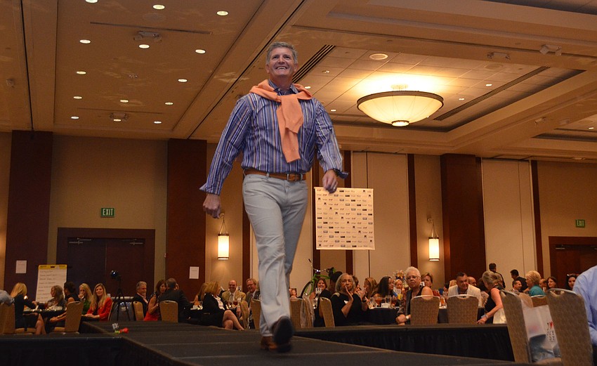 Joel Schemmel works the runway with a smile.