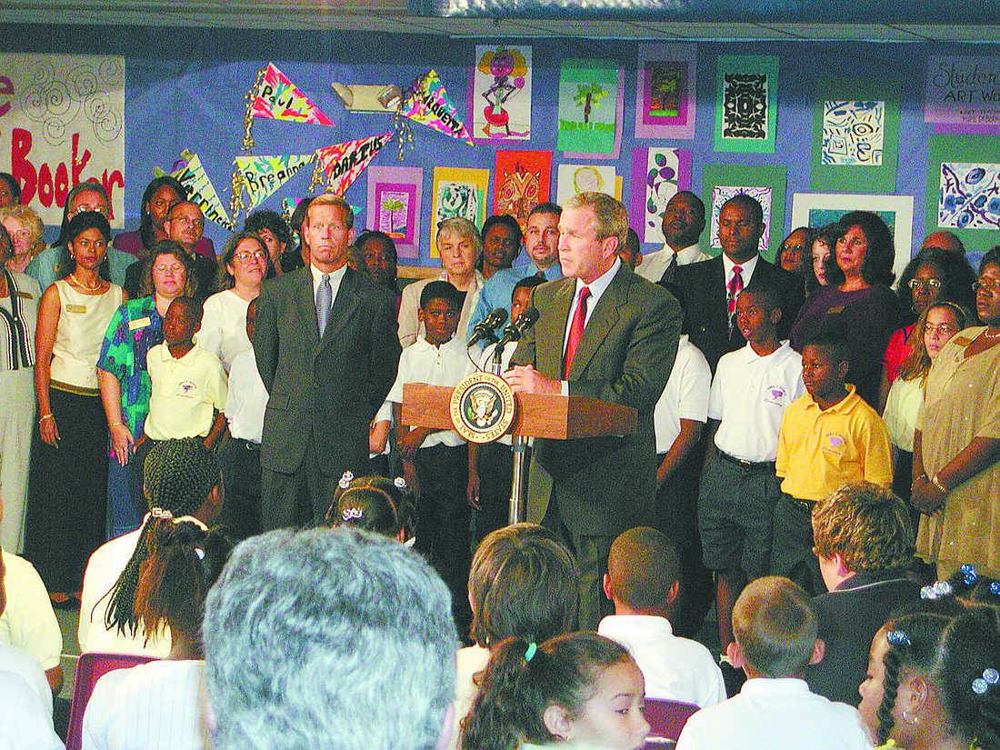 File photo. President George W. Bush gives a statement just minutes after learning of the attacks during a visit to Emma E. Booker Elementary School.