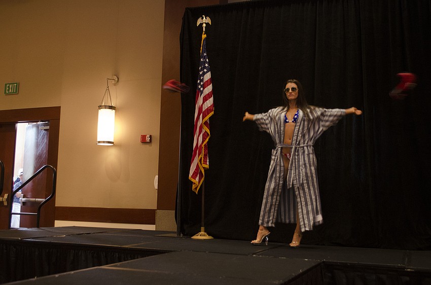 Shayla Twit ditches her boxing gloves before walking the runway.