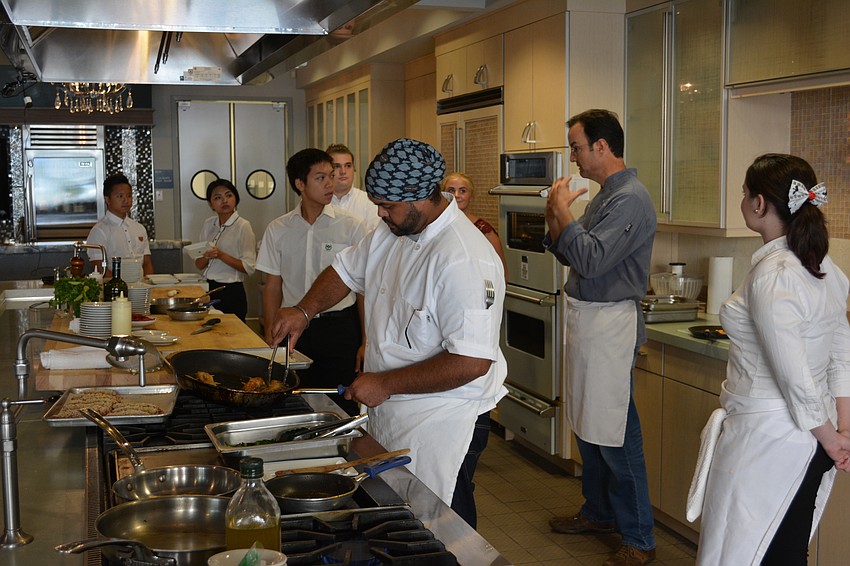 Chef Joe Askren, in the blue shirt, gets students ready for 
