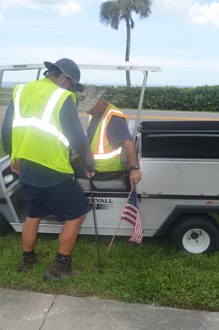 Troy Wooten and Frank Scrivani were one of four pairs that helped line GMD with flags.