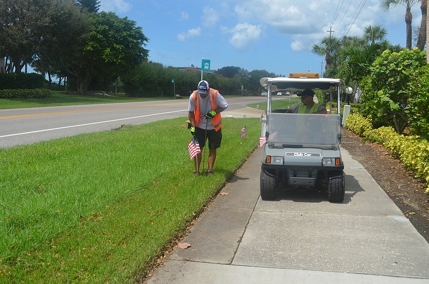 Mark Richardson and David Greene were one of four pairs that helped line GMD with flags on Sept. 9.