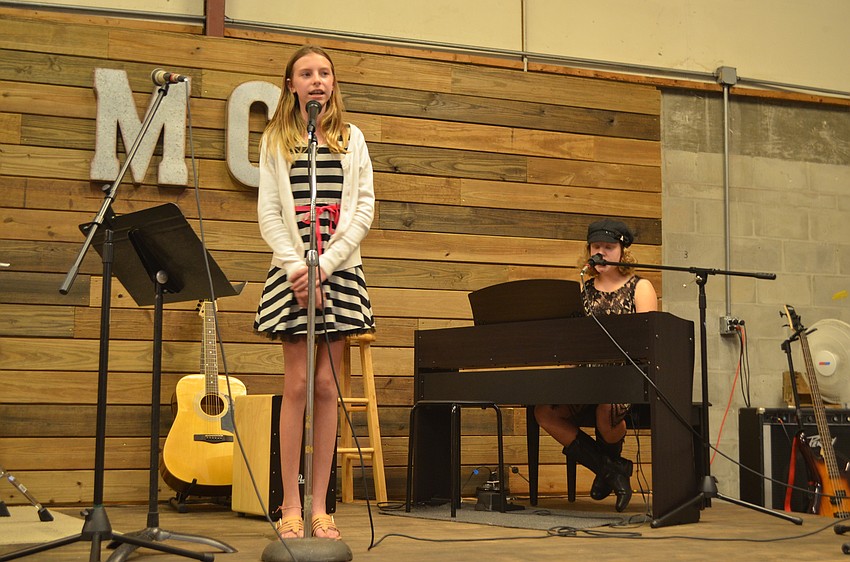 Music Compound students Elizabeth Hescock and Ashley Spadafora perform an original song that they wrote via a three-hour facetime call.