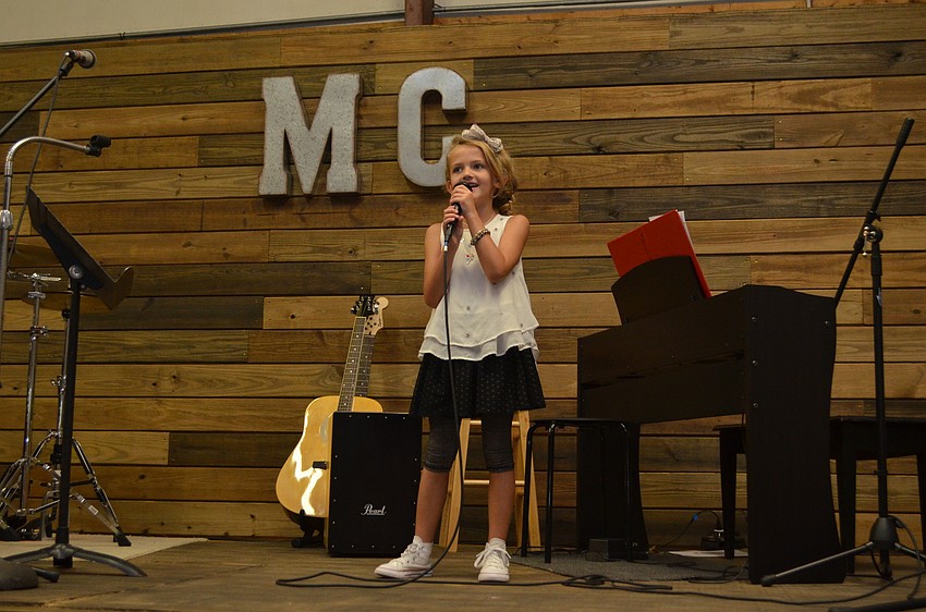 Music Compound student Caroline Jackson, 7, performs a cover of “Dibs” by Kelsea Ballerini.