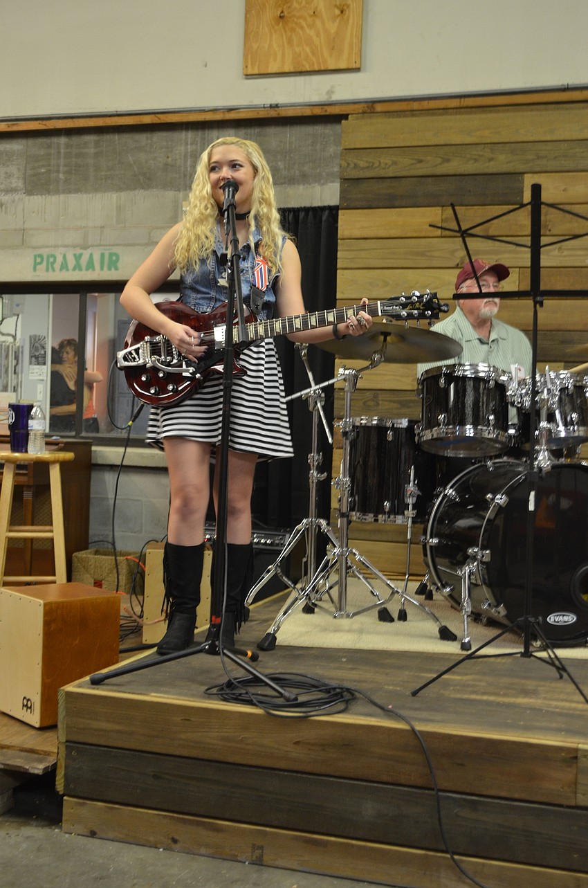 Music Compound teacher Savannah Brady performs alongside fellow teacher Chuck Parr.