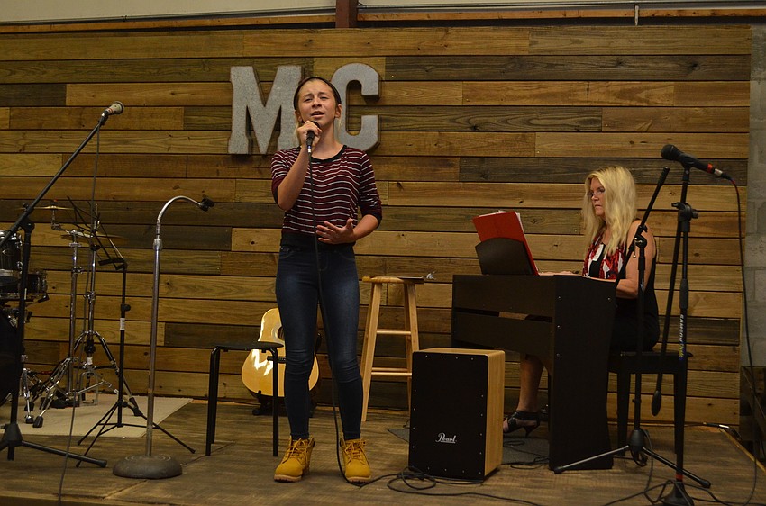 Music Compound student Sydney Verardo sings “Grand Piano” by Nicki Minaj while accompanied by teacher Denise Verheul on the piano.