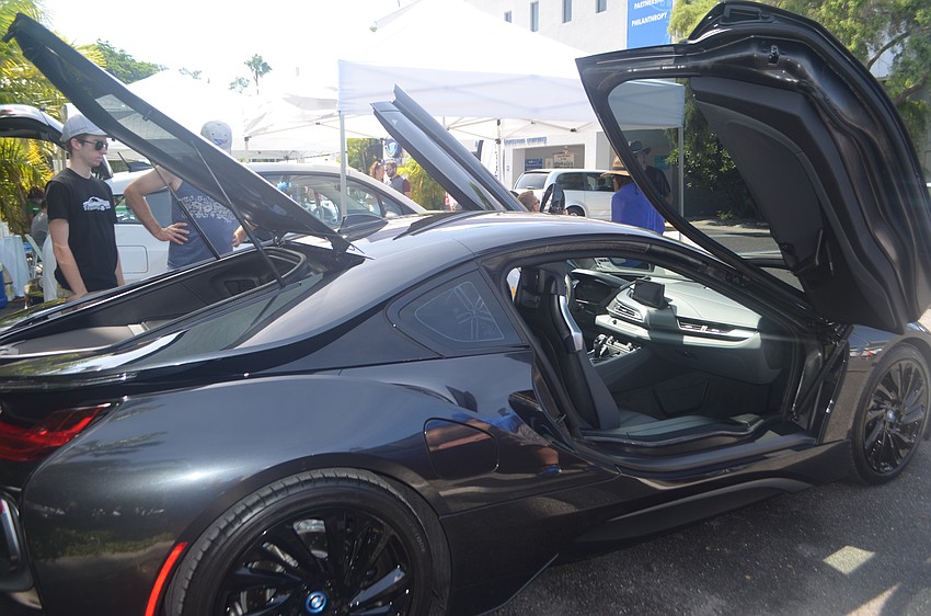 A BMW i8, or the “Batmobile,” as BMW of Sarasota employee, Taylor Marshall, said was one of many electric vehicles at this year’s Electrify the Island.