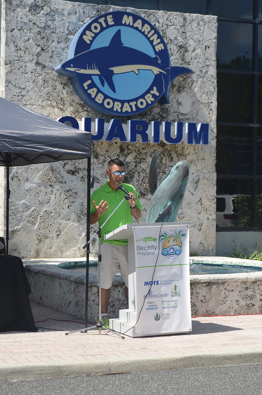 Co-chair of the event, Chris Sharek, welcomes guests to the event.