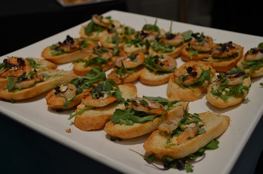 Grilled shrimp on crostini with honey chipotle aioli and arugula from Duval’s.
