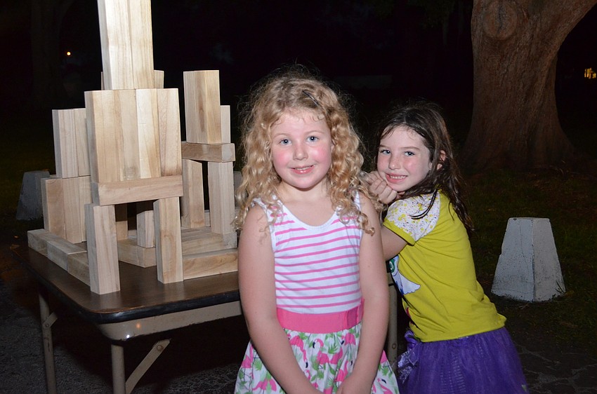 Piper Mulligan and Daphne Silvestri with the wooden castle they proudly built.