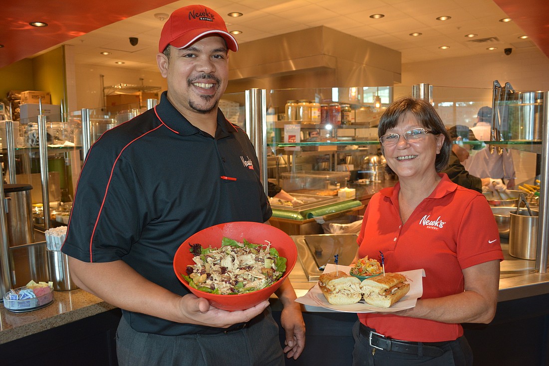 David Baker, the director of operations, and Jennifer Bledsoe, the general manager, were busy handing out free salads and sandwiches on Saturday night at Newk's Eatery.