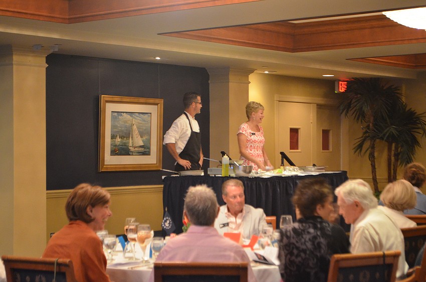 Commodore Lynn Smith introduces Chef Brent Williams to the dinner crowd.