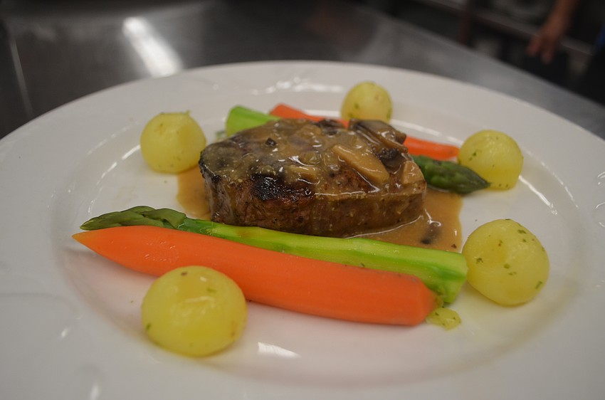 Members could choose between two dishes for dinner, red snapper with a sherry shrimp sauce or steak diane, pictured here.