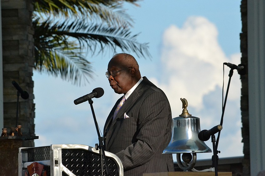 Sarasota City Mayor Willie Shaw leads the crowd in a community prayer.