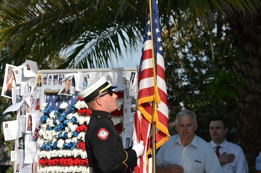A flag is presented to honor the victims of the attacks  during the Standing With Our Fallen 9/11 Fifteen Year Commemoration.