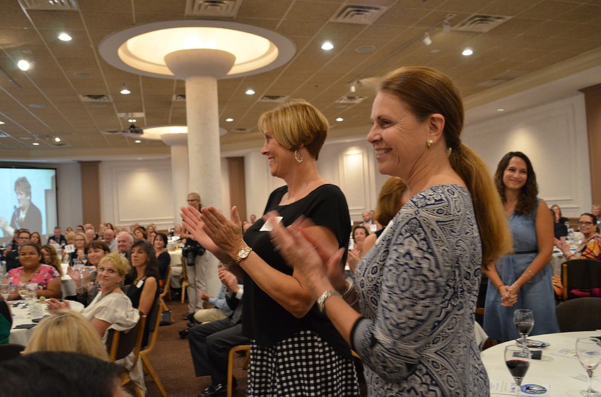 Members of the Alta Vista Elementary staff applaud for Barbara Shirley.