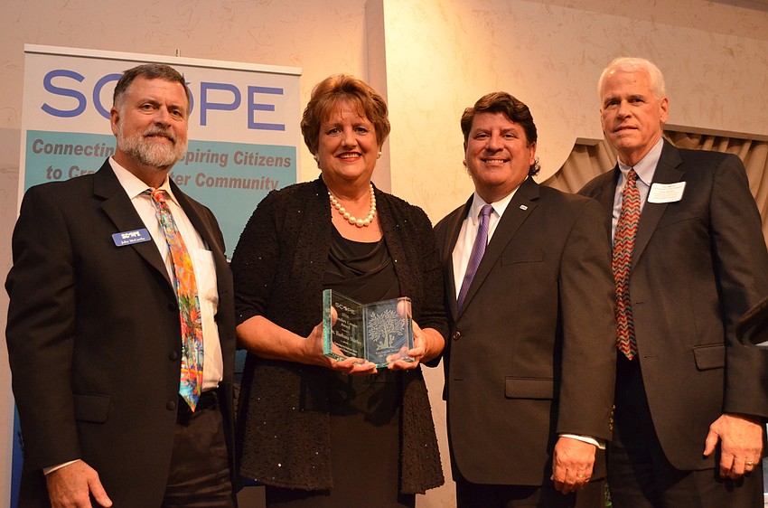 SCOPE Executive Director John McCarthy, 2016 Boundary Crosser recipient Barbara Shirley, SCOPE Board Chairman Tom Tryon and Dan Bailey.