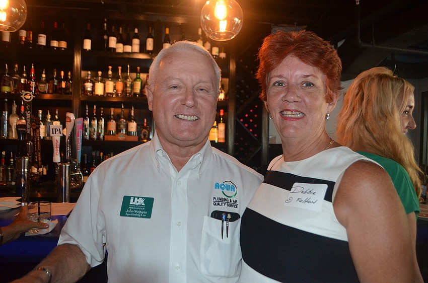 John Wojtyna of Aqua Plumbing and Air and Debbie Fulton