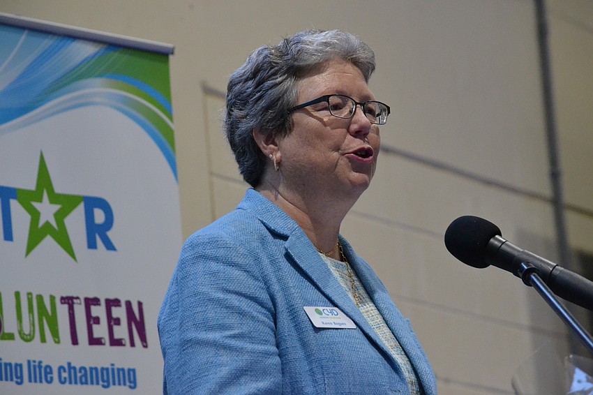 Former CYD Executive Director Karen Bogues addresses guests and CYD alumni.