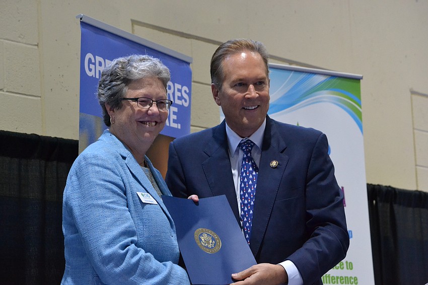 Former CYD Executive Director Karen Bogues is recognized by Rep. Vern Buchanan during the presentation.