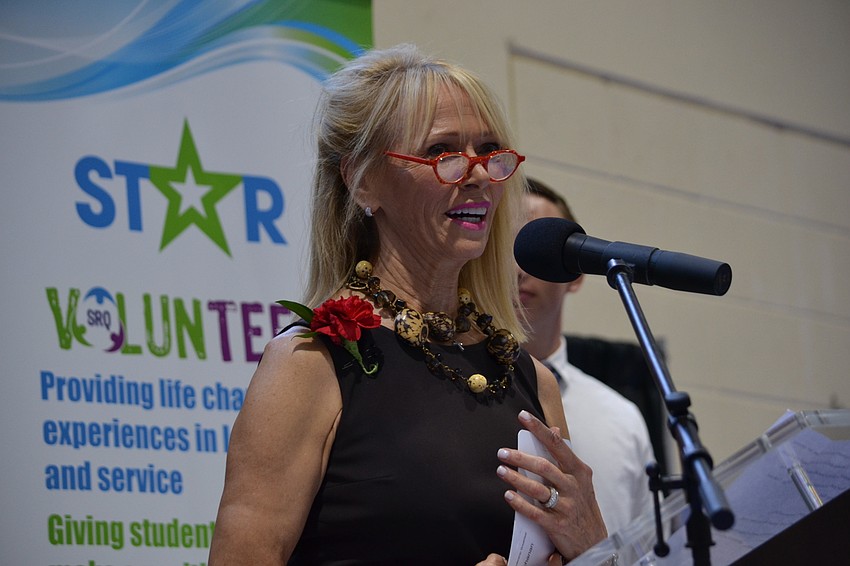 Sandy Buchanan addresses guests as an honoree alongside her husband Rep. Vern Buchanan during the 11th annual CYD Leadership Breakfast.