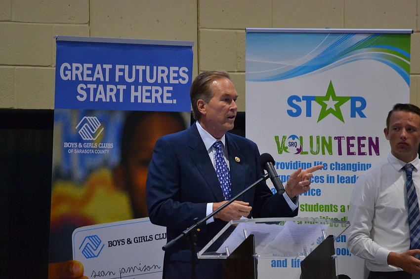 Rep. Vern Buchanan accepts the honor from Community Youth Development.