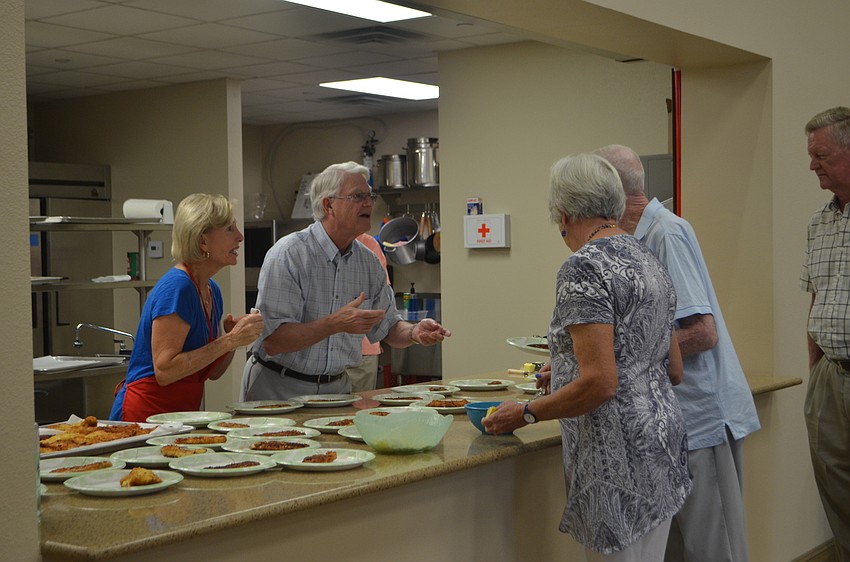Sally and George Rauch talk with Judy Williams and Chuck Fuller.