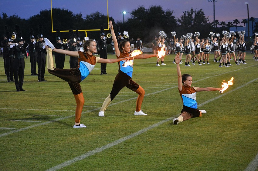The Mustangs' defense was fired up in the first half and so were baton twirlers Allysan Decker, Tori Price and Shannon Ray.