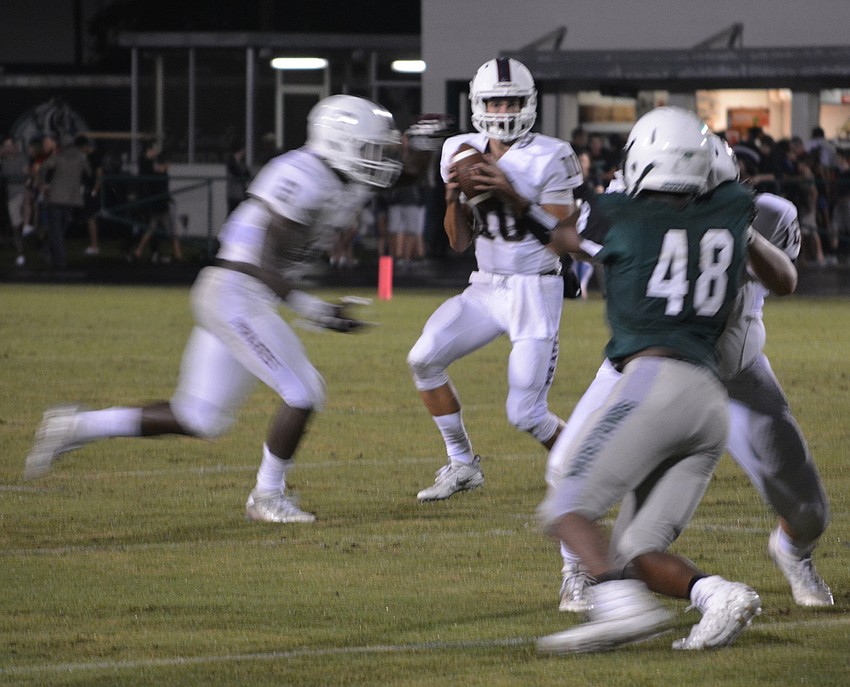 Braden River quarterback Louis Colosimo surveys the situation in the first half.