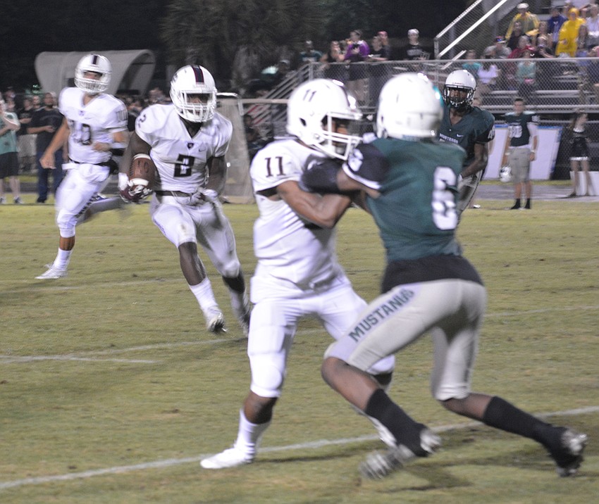 Pirates running back Deshaun Fenwich waits for a block to develop from Craivon Koonce.