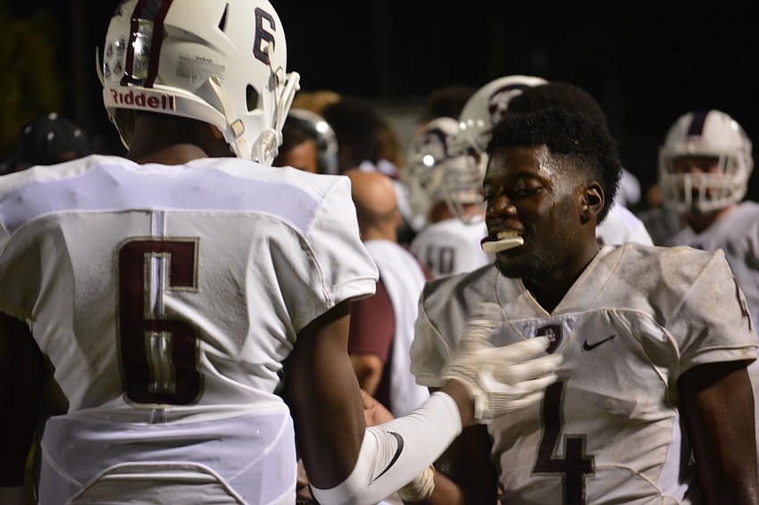 Braden River wide receiver Daveon Wortham celebrates with running back Raymond Thomas, who scored a pair of rushing touchdowns in the Pirates 31-7 win.
