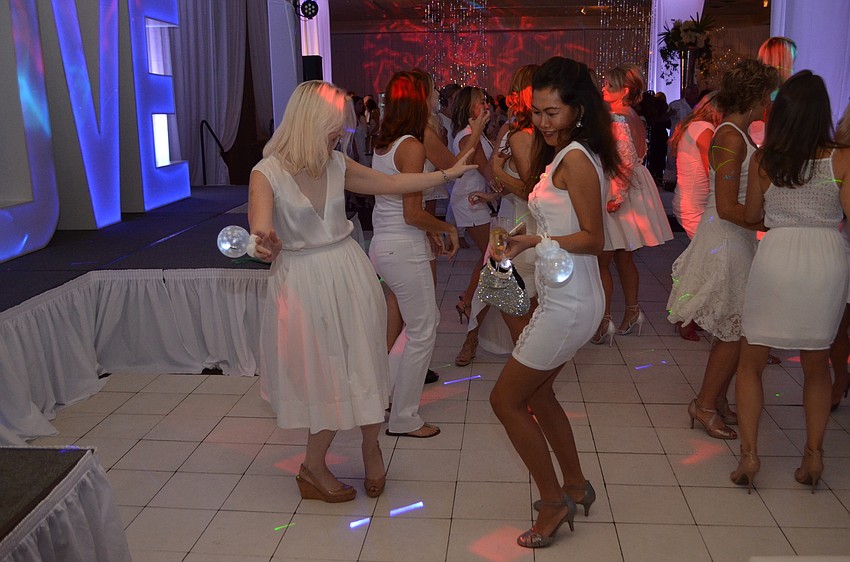 Sally Gruters and Orasa Del Vescovo bust a move on the dancefloor.