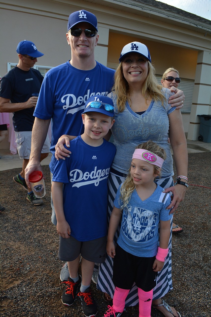 Kevin and Denise West come support their children, Kayden, 7, and Kyle, 4.. Kevin serves as the head coach for the Dodgers' team.