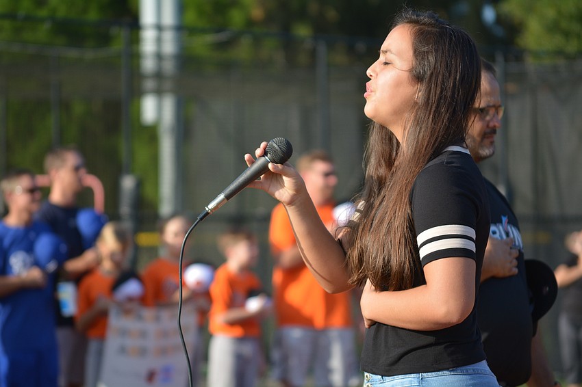 East County resident and Sarasota Military Academy junior Lauren Medred sings the national anthem.