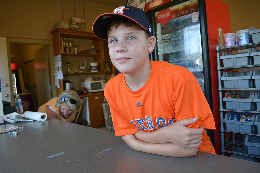 Cole Davis, an 11-year-old student at Haile Middle School, mans the concession stand before his 1 p.m. game.