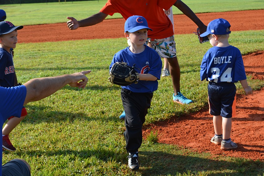 Chase Quigley proved an enthusiastic player on his team of 3 year olds.