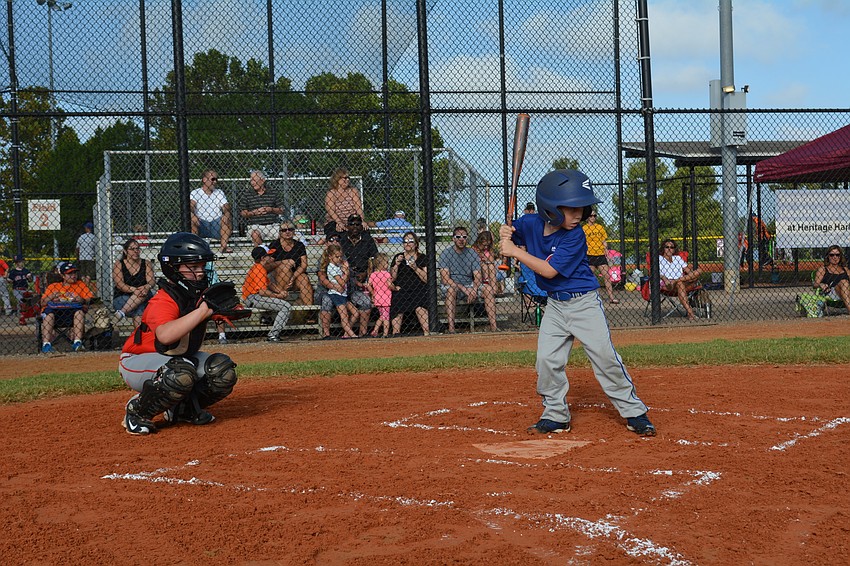 Quinton Johnson catches as Grayson Elder has his at bat.