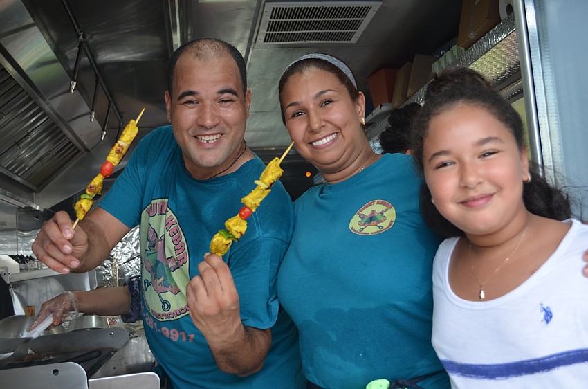 Lahcen and Hanane Demlak of Yummy Kebab Food Truck with their daughter Ghita.