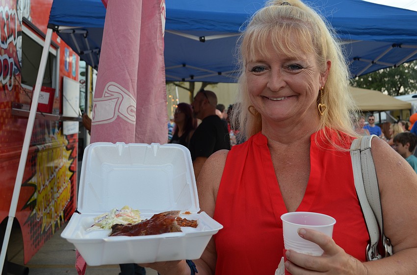 Leanna Hershberger with her serving of ribs from Mother Truckin Good.