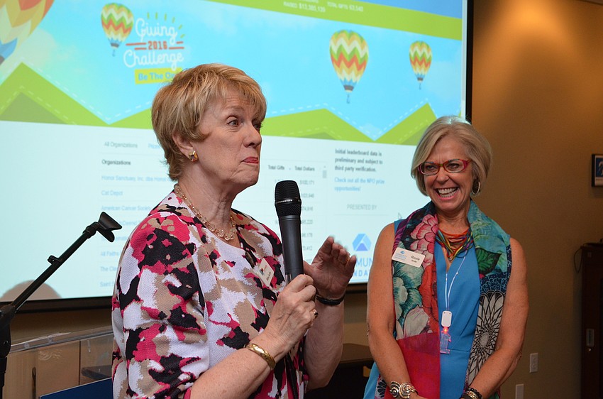 The Patterson Foundation President and CEO Debra Jacobs addresses the crowd after announcing the total with matches equals more than $13 million.