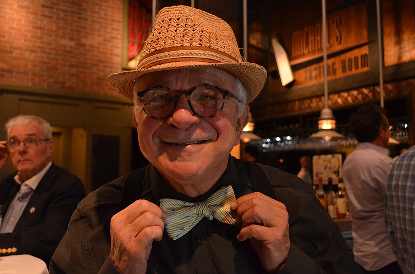 Alvan Kamis shows off his bowtie with martini cups.