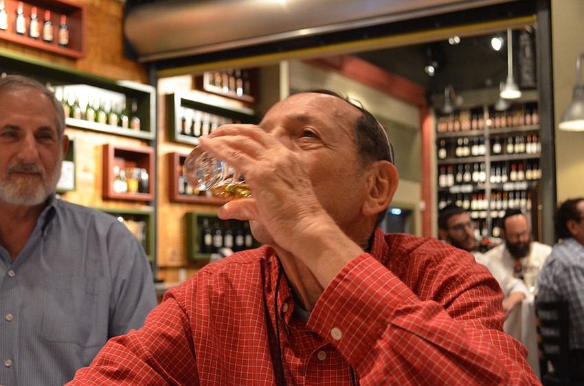 Harry Zeltnwirth samples the second course of Glenmorangie a Highland single malt Scotch whiskey.