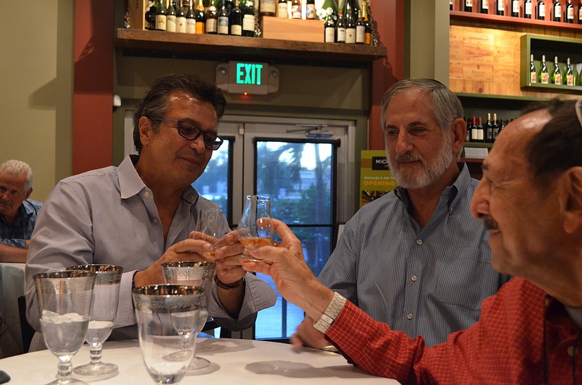 Marcus Anast toasts with Barry Gorn and Harry Zeltnwirth