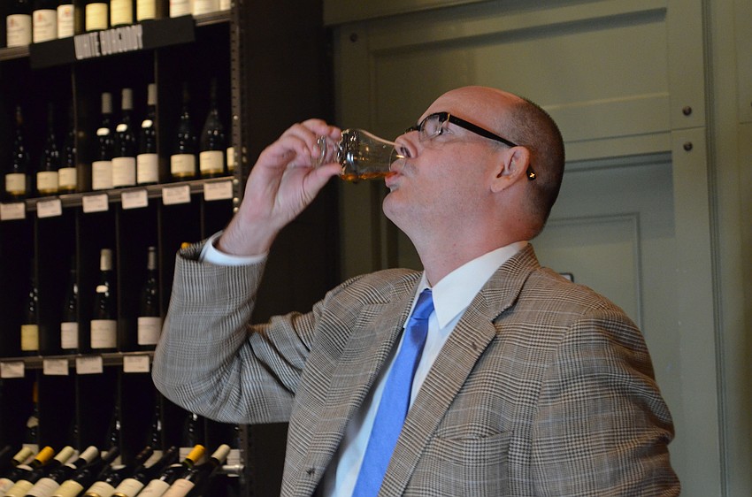 Whiskey expert Turner Moore demonstrates tasting techniques.