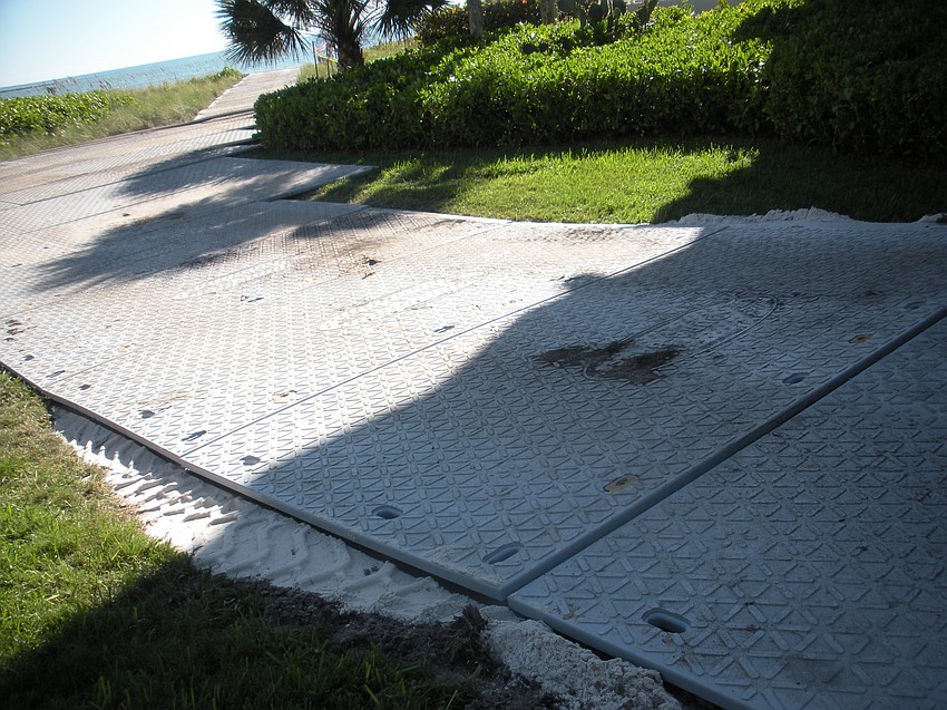 Mats help trucks access Longboat Key beaches during renourishment projects.