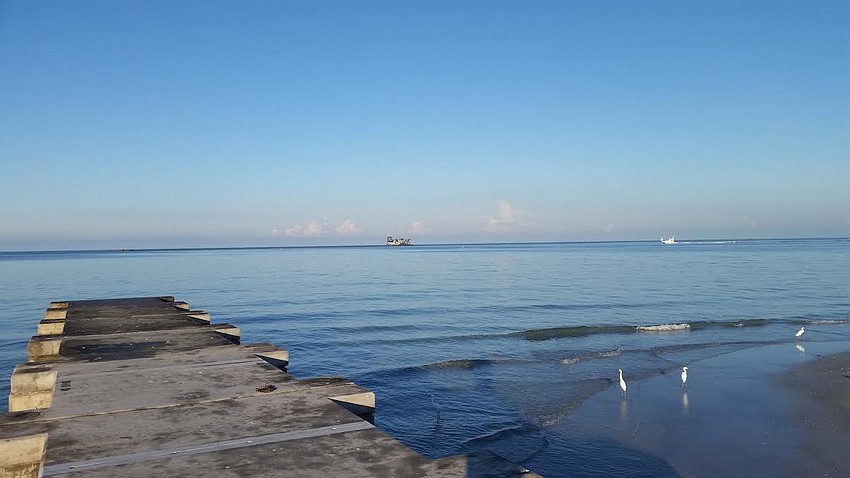 New Pass is clear of all dredging equipment. The dredge has been repositioned to Longboat Pass in the north of the island and the floating pipe and pipe barges are en route.