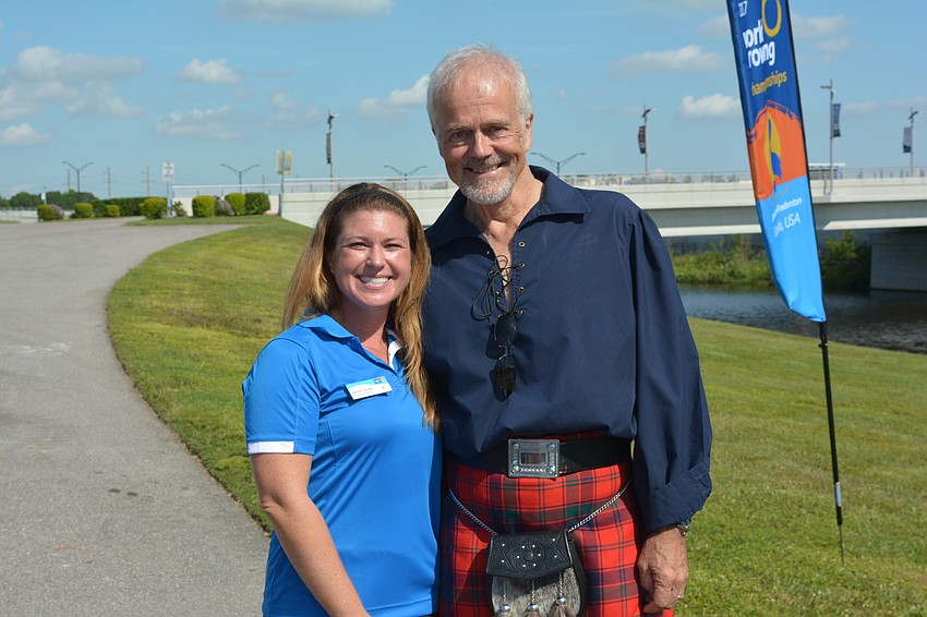 Meredith Scerba, who is the World Championship's event director, helped artist Malcolm Robertson unveil 